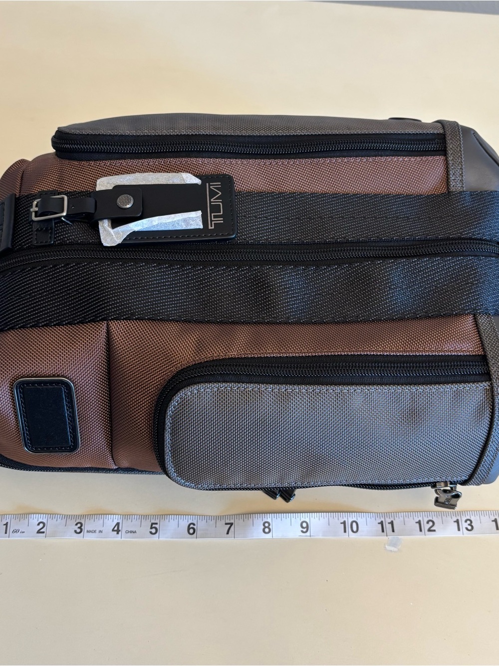 TUMI Higgins men’s sling pack black brown colorblock multi bag NEW - Picture 11 of 12